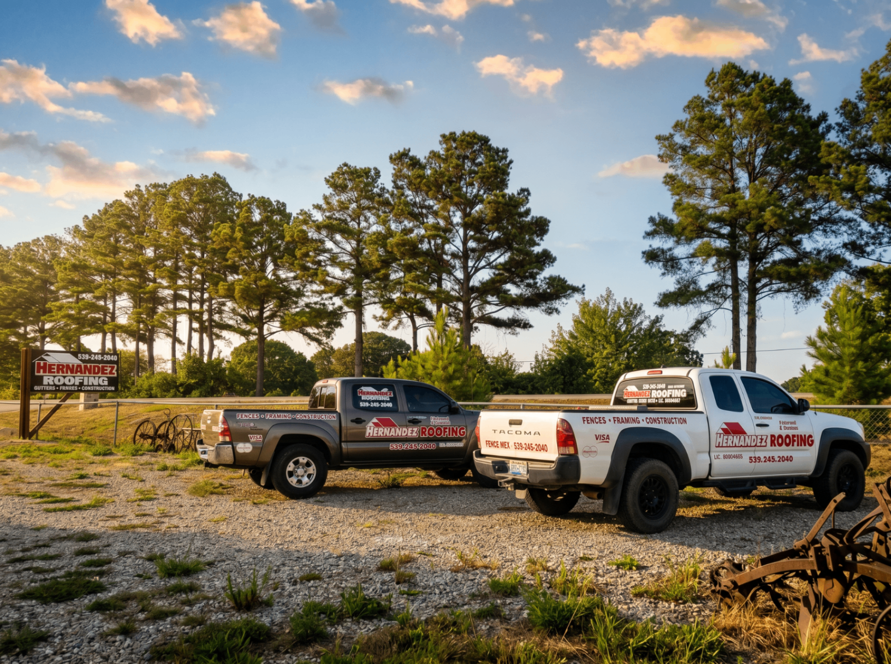 Hernandez Roofing branded work trucks parked at the shop in Pocola, Oklahoma